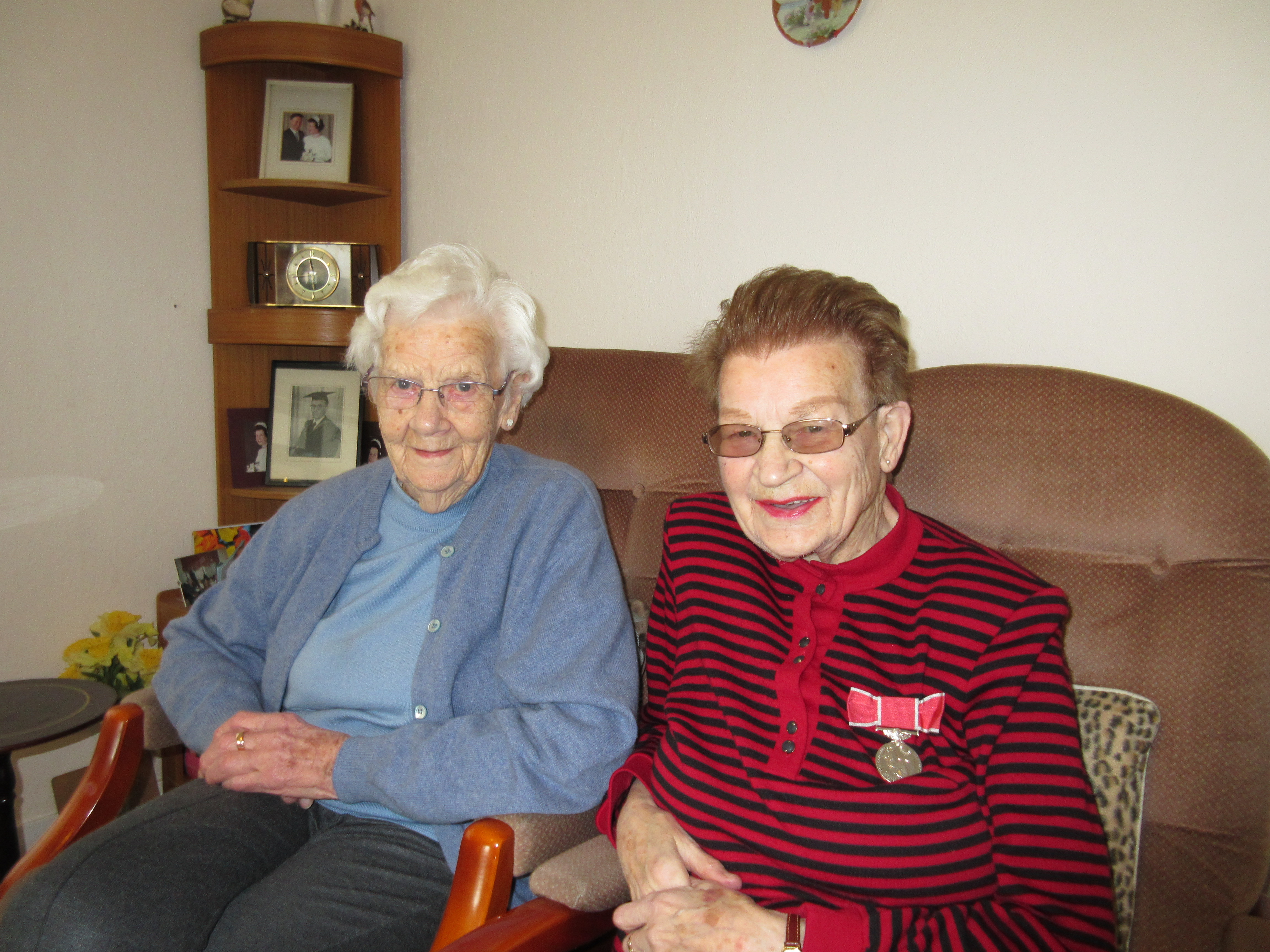 2014 - Annie Stuart with British Empire medal for services to church. With sister Nellie