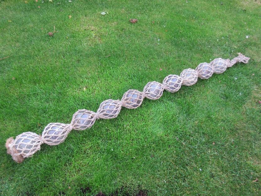 Glass ball floats secured with double twine netting.